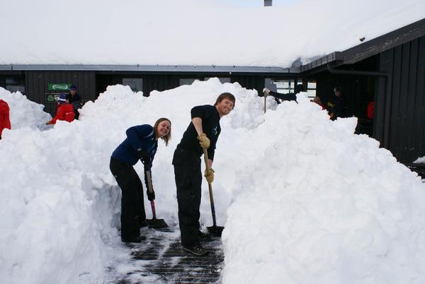 Ariska Mijnheer and Derek Altof digging in and clearing snow at the Mt Hutt base building.